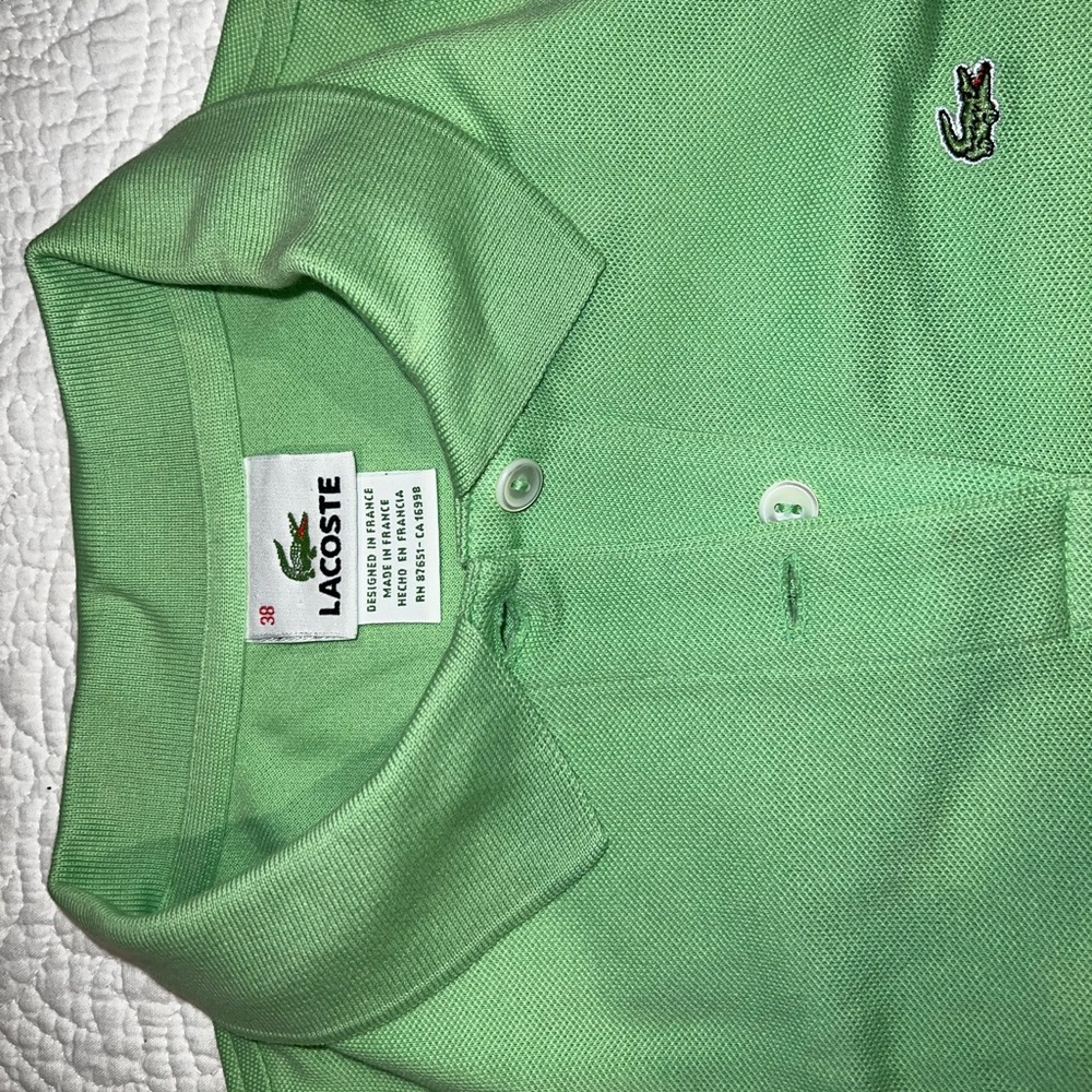 Lacoste sleeveless fitted pique golf or tennis shirt size 38
